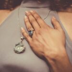 woman holding her chest close-up photo